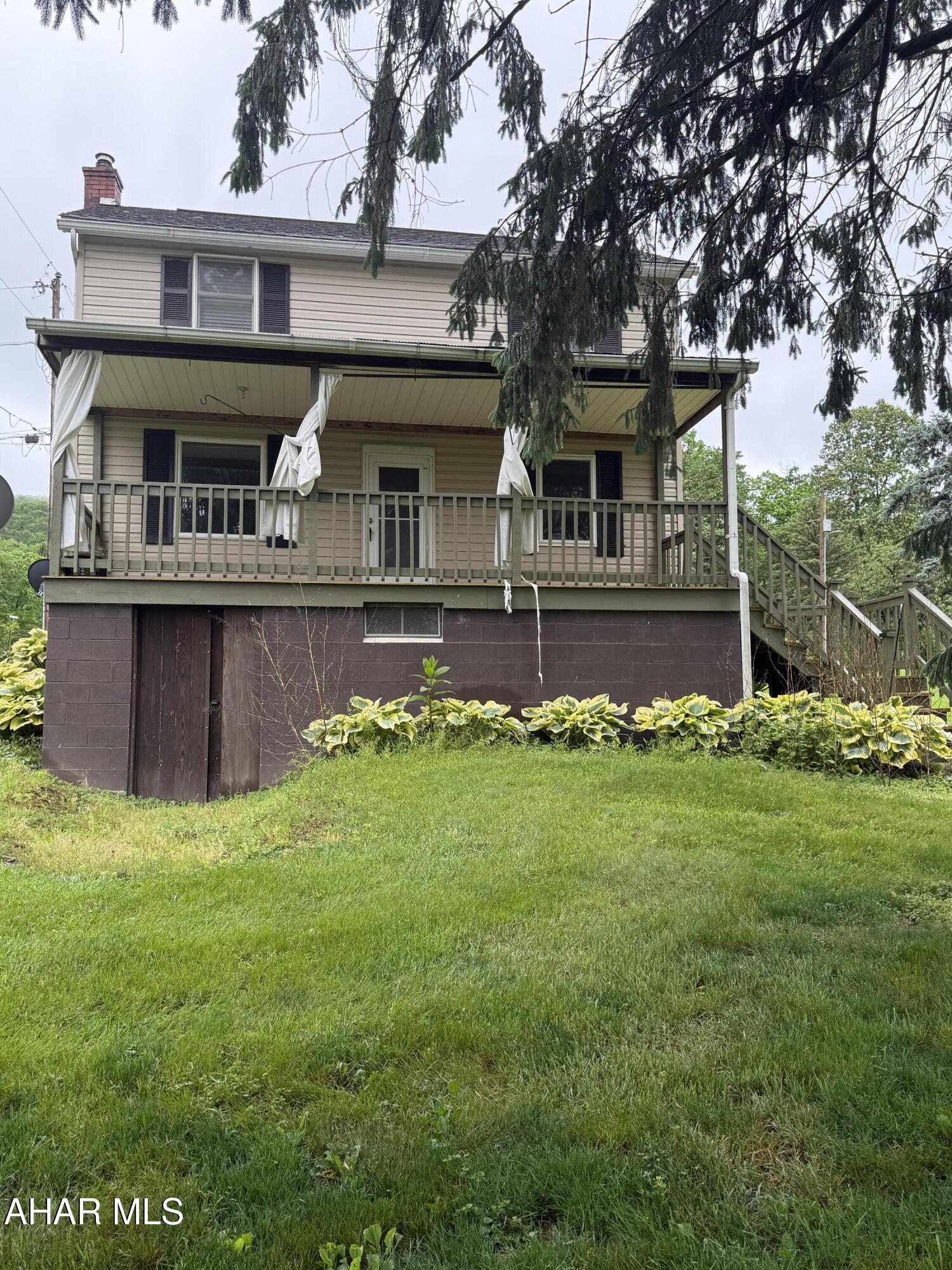 2 bedroom,1 bath home situated on a 0.69 acre lot.  Features include a large kitchen, plus both a covered front and back porch--perfect for relaxing and enjoying the outdoor space.