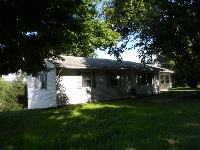 Sparkling 3 BR/2 BA vinyl clad home on corner lot in close proximity to Bedford's renowned highway network - I-99, PA Turnpike, US Route 30 & 220. This very neat and shaded ranch type home boasts an enclosed carport and recently renovated daylight, walk-out basement that adds valuable living space. Immediately available and ready for your family.