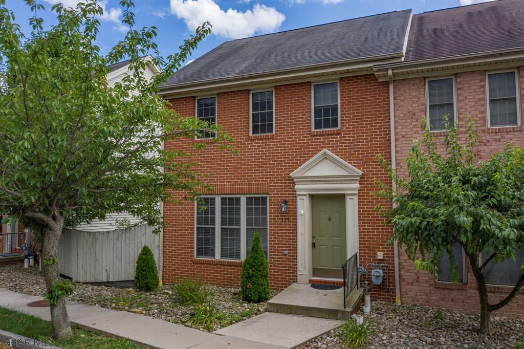Modern, brick end-unit townhouse in Holiday Hills with 2 car garage and beautiful mountain views. Open concept kitchen and finished lower level. Recessed lighting in living room, kitchen, bathrooms and family room. Stairs from deck to lead to the back patio and yard with waterfall feature.