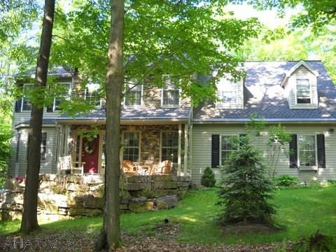 Exceptional 2 story stone and vinyl home on large landscaped lot. Custom quality throughout. Lots of updates. Beautiful wood floors. Plain and fancy custom kitchen. Oversized 2 car garage.
