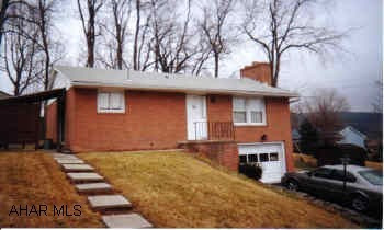 Brick Ranch with central air, brick fireplace in living room, covered patio off kitchen, and hardwood floors under carpet. Brick Ranch with central air, brick fireplace in living room, covered patio off kitchen, and hardwood floors under carpet.