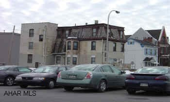 3 unit brick. Renovated mid 80's. All separate utilities including water & sewer.