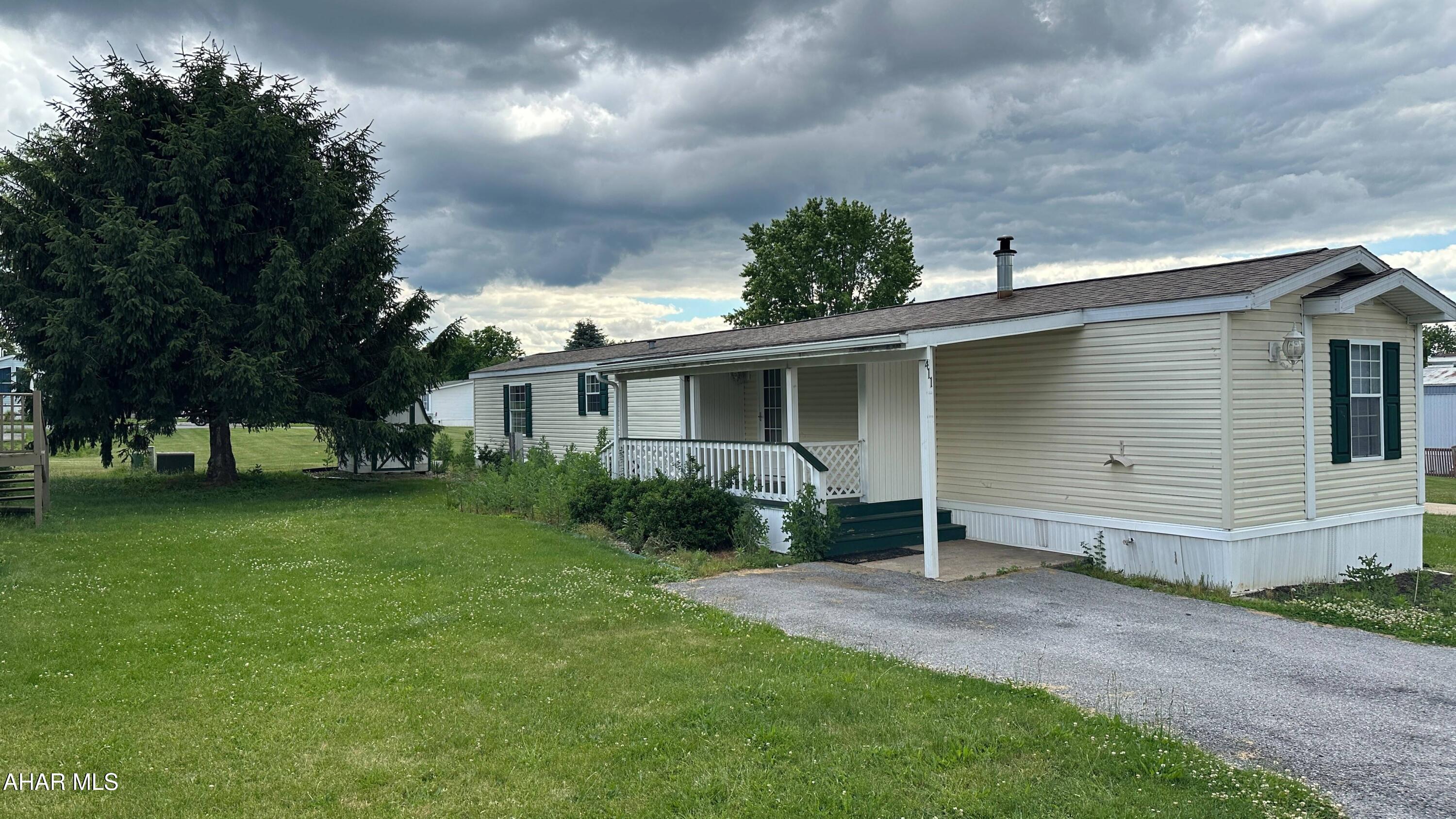 Beautifully well-kept home in quiet neighborhood.  Open floor plan.  Appliances included.  Home has new flooring and a newer roof.  Central air.  Large porch and sturdy storage shed.  This mobile home is owned by the listing real estate agent.