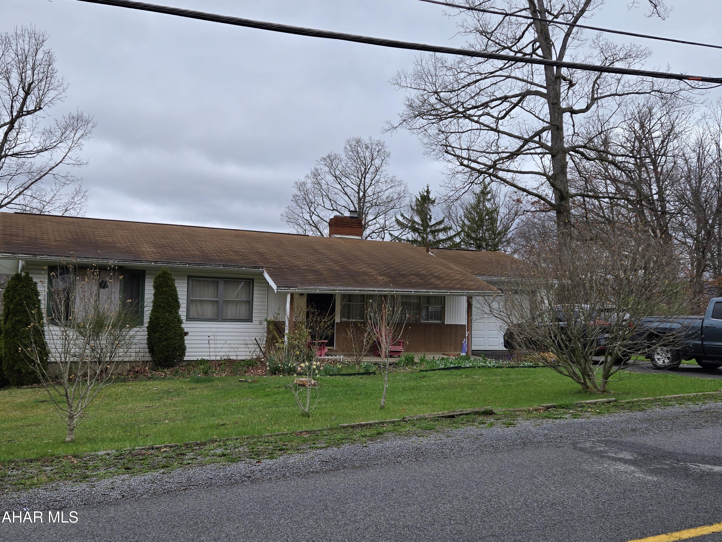 3 bedroom, 2 full & 1 half baths with a one car garage and workshop underneath. Partial fenced yard and above ground pool in Hollidaysburg SD.