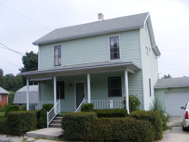 Two story vinyl sided home with Living Room, Dining Room, eat in kitchen, bath and laundry room on the first floor. 3 bedrooms and bath on second floor. Newer roof and hot water baseboard heat.