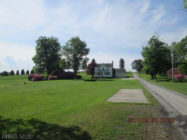 Large 2 story home on 4.2 acres.  Multiple garages with plenty of storage and a small spring fed pond. RV parking areas.