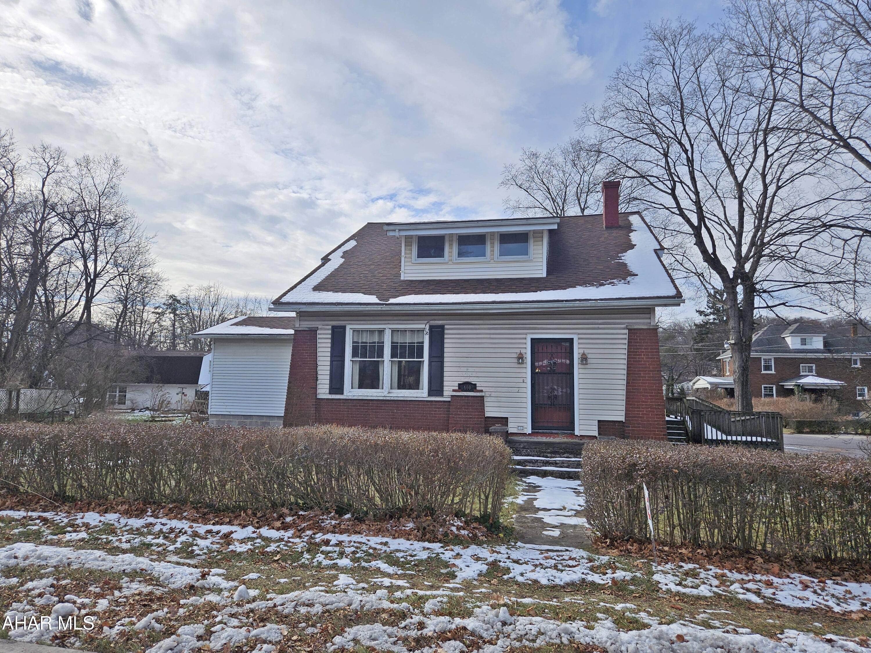 This charming home highlights beautiful original woodwork and timeless architectural character throughout. It offers generous living spaces, including a large family room addition ideal for gatherings, as well as a convenient first-floor bath for added functionality. The second-floor enclosed porch provides a versatile retreat, while abundant closets and storage areas enhance everyday convenience. Situated on a huge yard with plenty of outdoor potential, the property also includes an oversized garage with substantial additional storage.