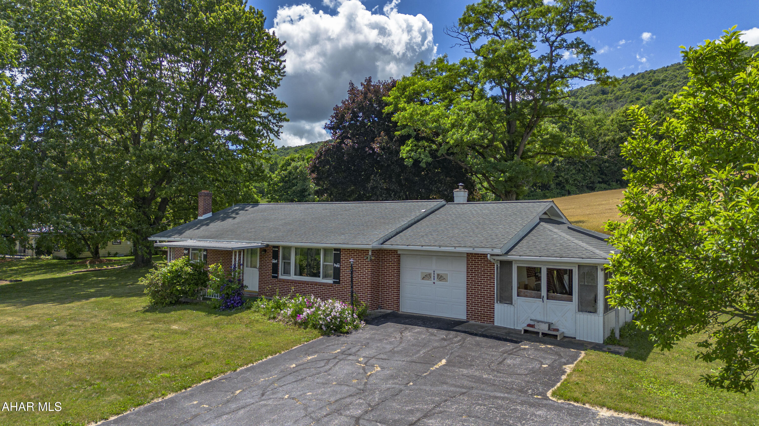 This one-story, all-brick ranch home sits on a 0.57-acre lot. The main level includes a kitchen, a dining room, a large living room, two bedrooms, and a full bathroom. A one-car garage provides parking, and a closed-in side porch offers additional functional space. The property features a large basement for utilities and storage, and the home is equipped with central air conditioning. The interior needs updating and awaits your personal touches. Schedule a tour.