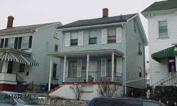 3 BEDROOM, 2 STORY WITH LOW TAXES, "AS IS" "'REDUCED"!  COZY 3 BEDROOM, 2 STORY HOME JUST OFF 17TH STREET BY THE HIGH SCHOOL WITH NEW ELECTRIC SERVICE, OAK KITCHEN, NEW SIDING, AND NEWER ROLLED ROOFING & SPOUTING.  INCLUDES REFRIGERATOR, RANGE, WASHER AND DRYER.  NEEDS SOME WORK.  "AS IS"