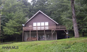 "A" FRAME DESIGN WITH SEPARATE ELECT. & KIT. ON GROUND LEVEL.  BLUE KNOB CHALET WITH 6 BEDROOM & 3 BATHS. "A" FRAME DESIGN, LR W/GAS FIREPLACE, FIRST FLOOR HAS WOOD BURNER AND ALL FURNITURE, APPLIANCES, AND COOKWARE ARE INCLUDED. GROUND FLOOR HAS SEPARATE ELECTRIC & KITCHEN FOR RENTAL PROPERTY.  1ST FLR CURRENTLY RENTED UNTIL 8/31/05.  TENANT PAID ANNUALLY PLUS HIS UTILITIES.