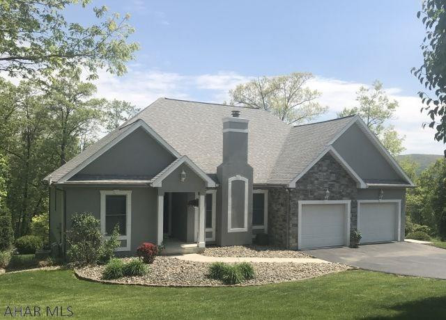 Meticulously maintained 4BR, 3BA Ranch in the Elmwood area of Hollidaysburg. Home has been remodeled with many custom upgrades. Home features vaulted living room ceiling with crystal chandellier & custom gas fireplace, large custom walk-in shower, 1st floor laundry, large ceramic tile throughout except for neutral light color carpet in bedrooms, finished basement, all neutral palate, upperdeck & lower stamped patio on a private picturesque .3 acre lot. Agent owned.