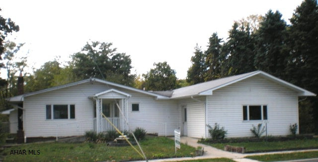 Spacious and very unique 2 Bedroom, 2 Bathroom house with attached/heated 2 car garage and separate 1 car garage/workshop area. Other features; 2 heating systems (hot water and gas forced air),Central Air, Living Room with gas fireplace, Dining Room,hardwood floors,large Sun room with skylights, Bonus Room with Kitchen that has potential for efficiency apartment or  mother in law suite. Spacious basement with workshop, storage space and potential for finishing as a large family room. Rear portion of the property has a huge fenced area for extra parking or entertaining as well as a separate fenced yard and dog run.  Property is being sold as is condition. Current Flood Elevation Certification Available for review.