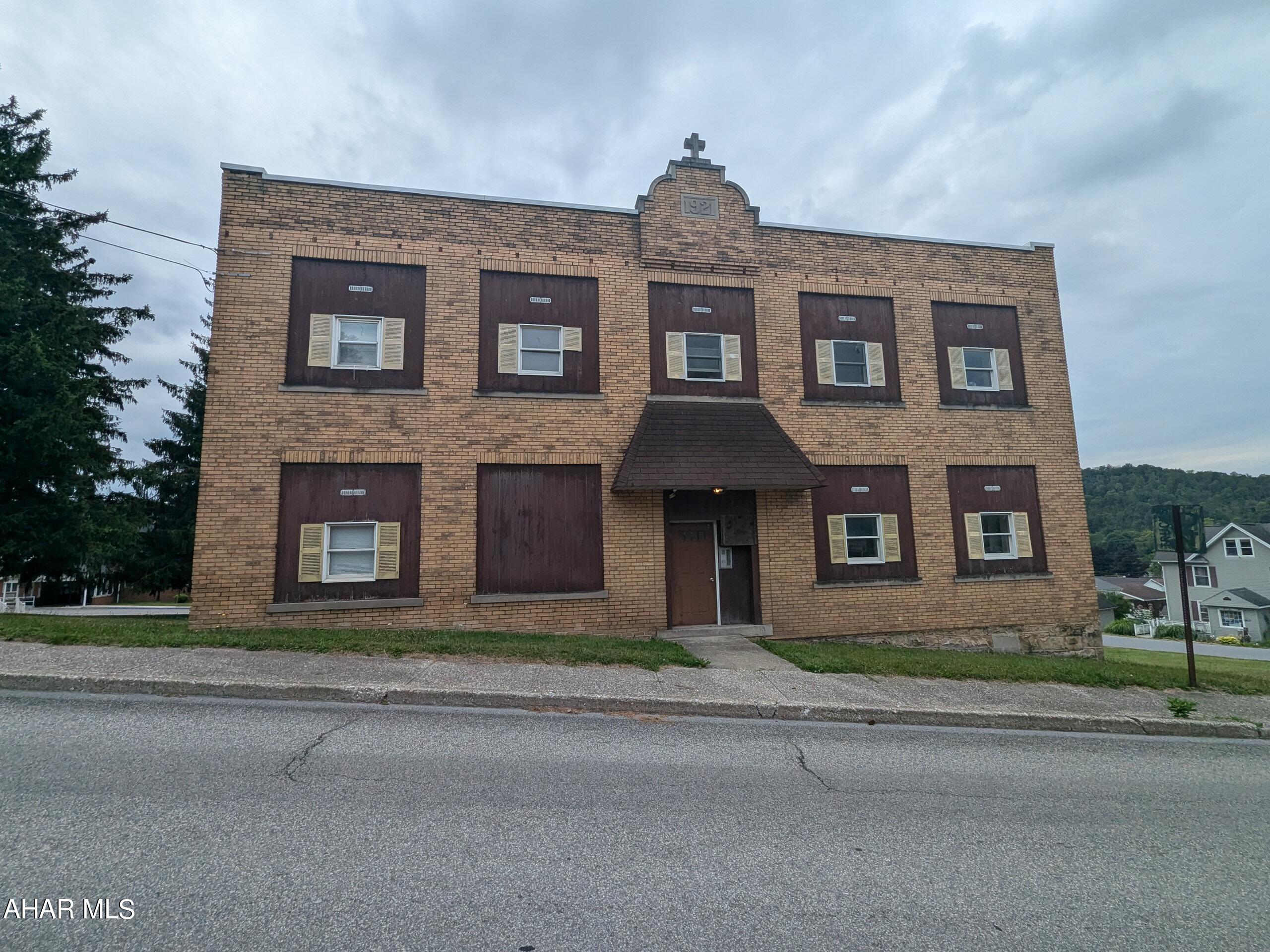 Attention investors! Unique opportunity for 7 unit 2 story brick apartment building in Ashville! New metal roof 2021. Includes 2 units on first and second floor plus finished basement with 3 additional units. Currently fully occupied with good rental history. Separate electric to each unit with tenants paying electric BB heat. Owner pays sewer (well water), trash, snow removal, lawn care, taxes and insurance. Rear parking lot and adjoins to park!