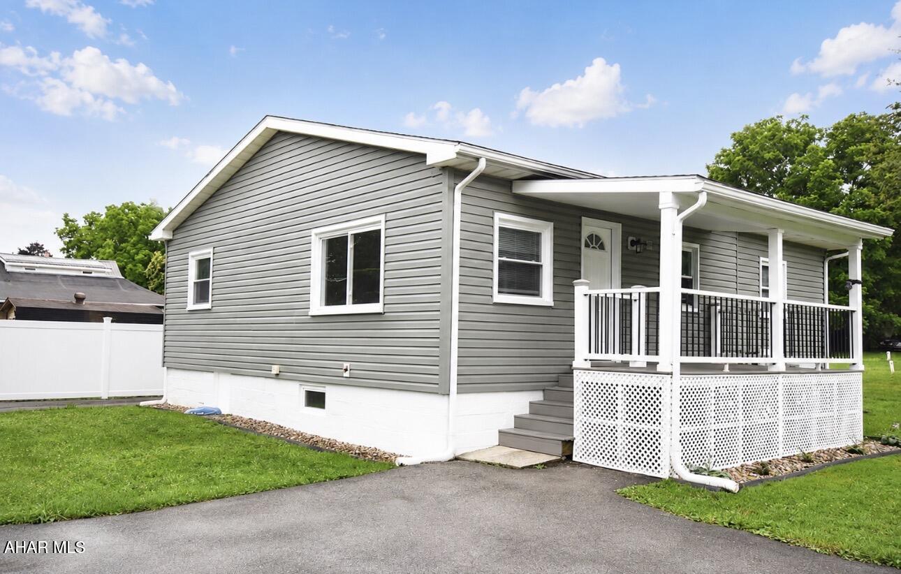 Almost like new construction.  Just about everything is brand spankin new!!!  Large eat in kitchen with all new stainless steel appliances.   En-suite main bedroom, nice size second bedroom and hall bath.   Large laundry room has enough space to double as a hobby room, small office, or even a tv room with pull out sofa for guests.  
Two new covered porches to enjoy the outdoors.   Plenty of off street parking in front, and in the driveway with carport.   This is truly a house that  you can just move in and enjoy immediately.