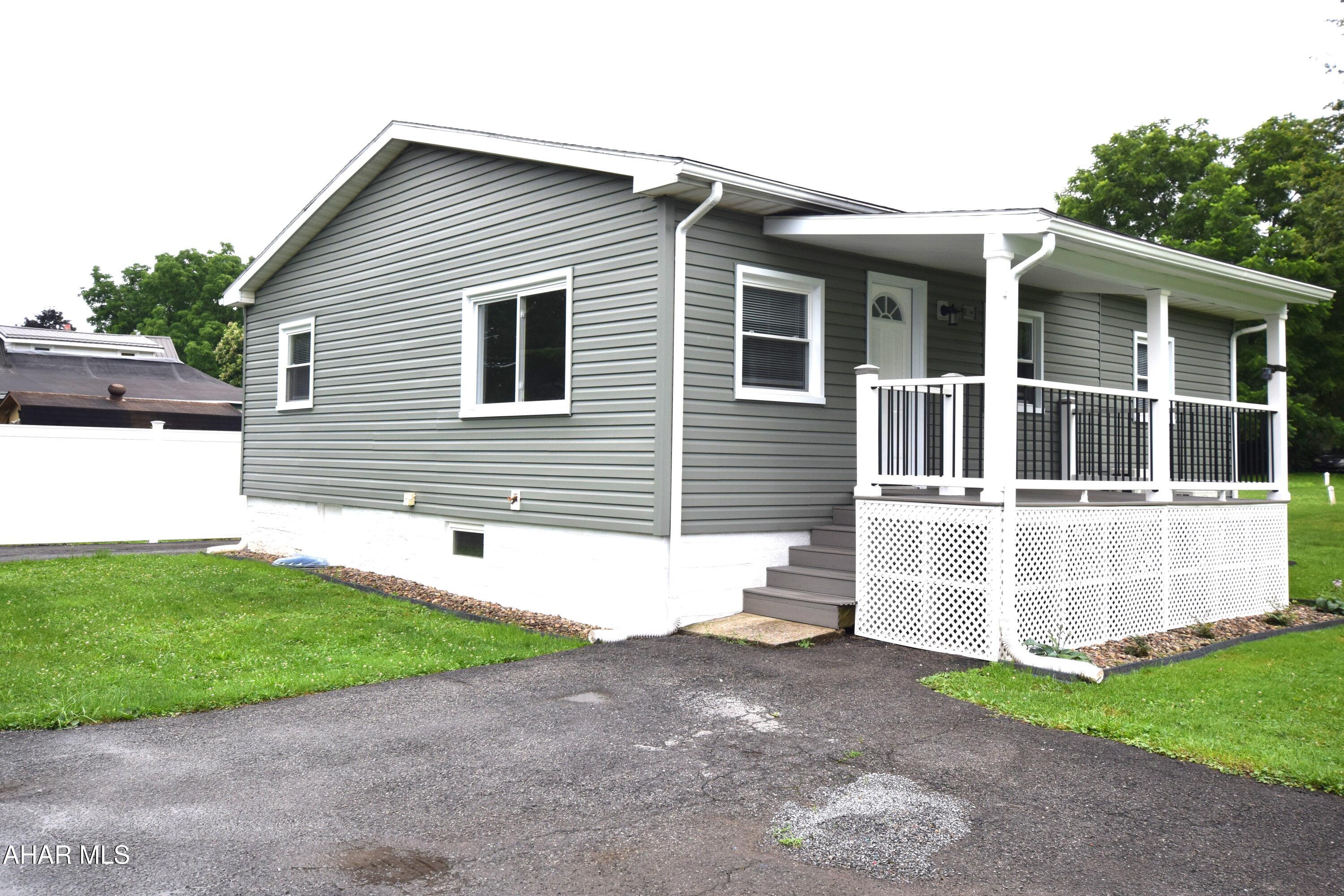 Almost like new construction.  Just about everything is brand spankin new!!!  Large eat in kitchen with all new stainless steel appliances.   En-suite main bedroom, nice size second bedroom and hall bath.   Large laundry room has enough space to double as a hobby room, small office, or even a tv room with pull out sofa for guests.  
Two new covered porches to enjoy the outdoors.   Plenty of off street parking in front, and in the driveway with carport.   This is truly a house that  you can just move in and enjoy immediately.