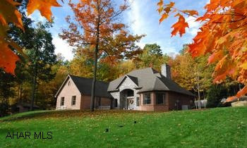 Elegant brick and stone home on a quiet cul-de-sac. Just 12 minutes from downtown Bedford. Elegant brick and stone home on a quiet cul-de-sac. Beautiful outside landscaping, lovely rear stone patio, brick garden shed. Two car attached garage, home has a security system as well as central vacuum, plus multitudes of interior upgrades. First floor has an octagon shaped master bedroom with master bath. Sunken living room with gas fireplace. Two bedrooms and a full bath on 2nd floor. Main level laundry and half bath. Fully finished basement with half bath. Home offers elegance and luxury.