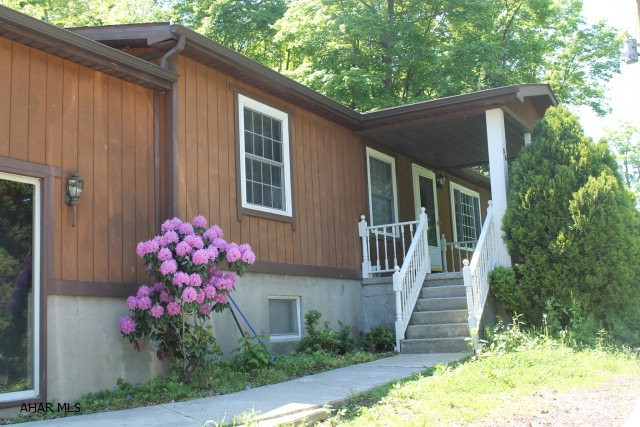 *Offer has been accepted. Waiting for contingencies to be met* This house is nestled on 1.65 acres surrounded with trees to allow the perfect amount of privacy. The back yard is completely fenced in with beautiful natural landscape and plenty of room for growth of outside living. Newer carpet and kitchen flooring gives this house a ton of character. Must see to appreciate. The unfinished basement has great potential to add more living square footage and leads out to a breezeway that connects the house to the large 2 car garage. The garage has a chimney that can be connected to a heat source for warmth in the work space. Do not wait to feel the comfort this rural home has to offer.