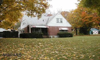 1 1/2 story red brick, detached 2 car garage. New interior paint/move in condition.