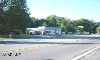 Great corner lot with rented service garage. 1 1/2 story home & 2 car garage. 273' road frontage in Greenwood. Business is not included. 1.12 acre level commercial lot. Great corner lot with rented service garage. 1 1/2 story home & 2 car garage. 273' road frontage in Greenwood. Business is not included. 1.12 acre level commercial lot.