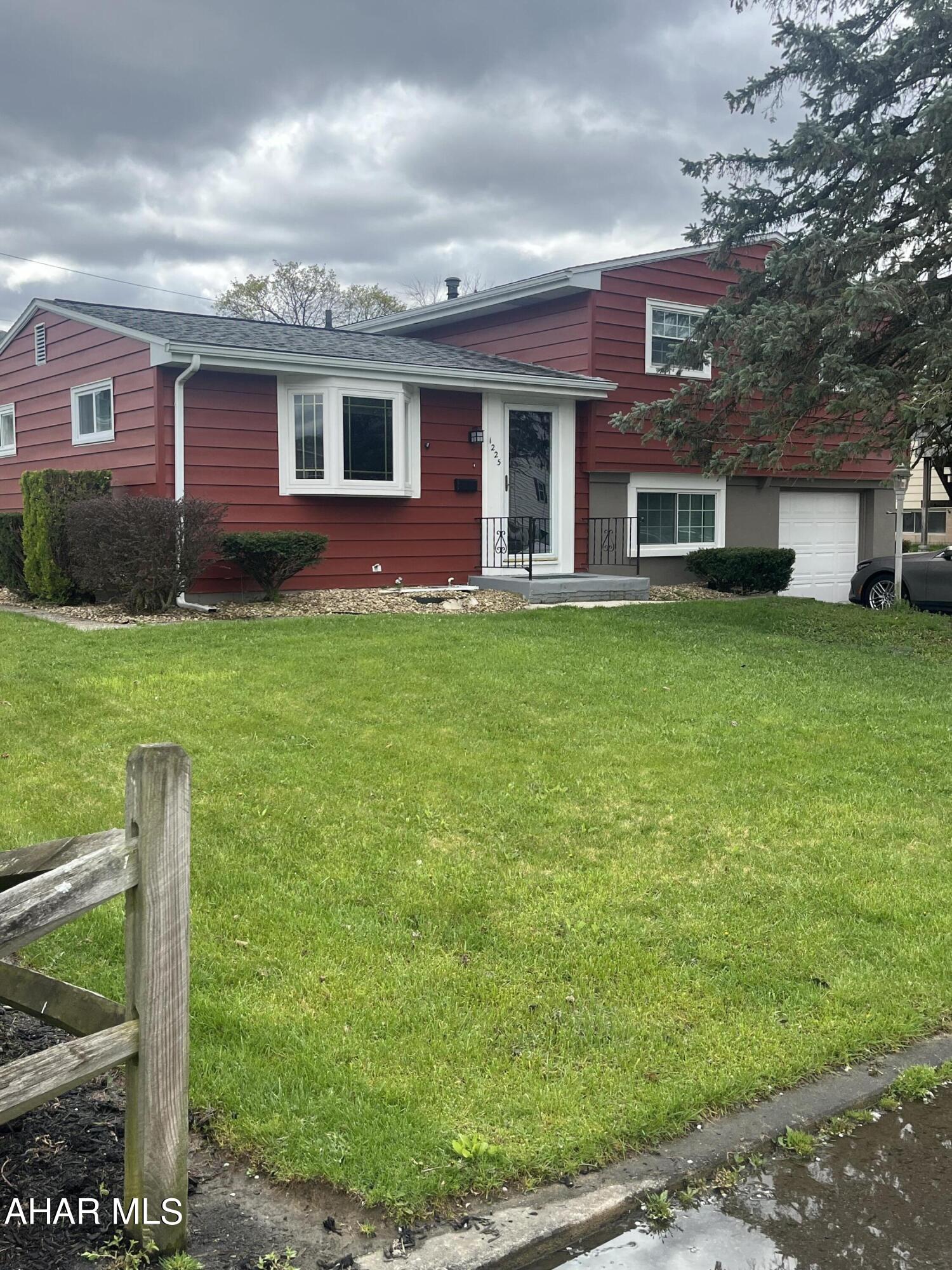 Welcome to this charming home in the Pleasant Valley Area of Altoona! Step inside to discover a beautifully updated interior featuring new window that flood the space with natural light. The kitchen is a chef's dream with all brand new appliances that stay with the home, a center island, new cabinets, and flooring. The open floor plan seamlessly connects the kitchen to the dining room, perfect for entertaining guests.

As you explore further, you'll notice distressed accented hardwood floors throughout most of the house, adding a touch of warmth and character. The lower level family room is ideal for cozy movie nights on the weekends.

Outside, the updated landscape adds to the curb appeal, and the brand new water heater ensures efficient comfort. With an attached garage and off-street parking, convenience is at your fingertips.

Don't miss out on this fantastic home with so many great updates. (taxes and sq ft verified by buyer