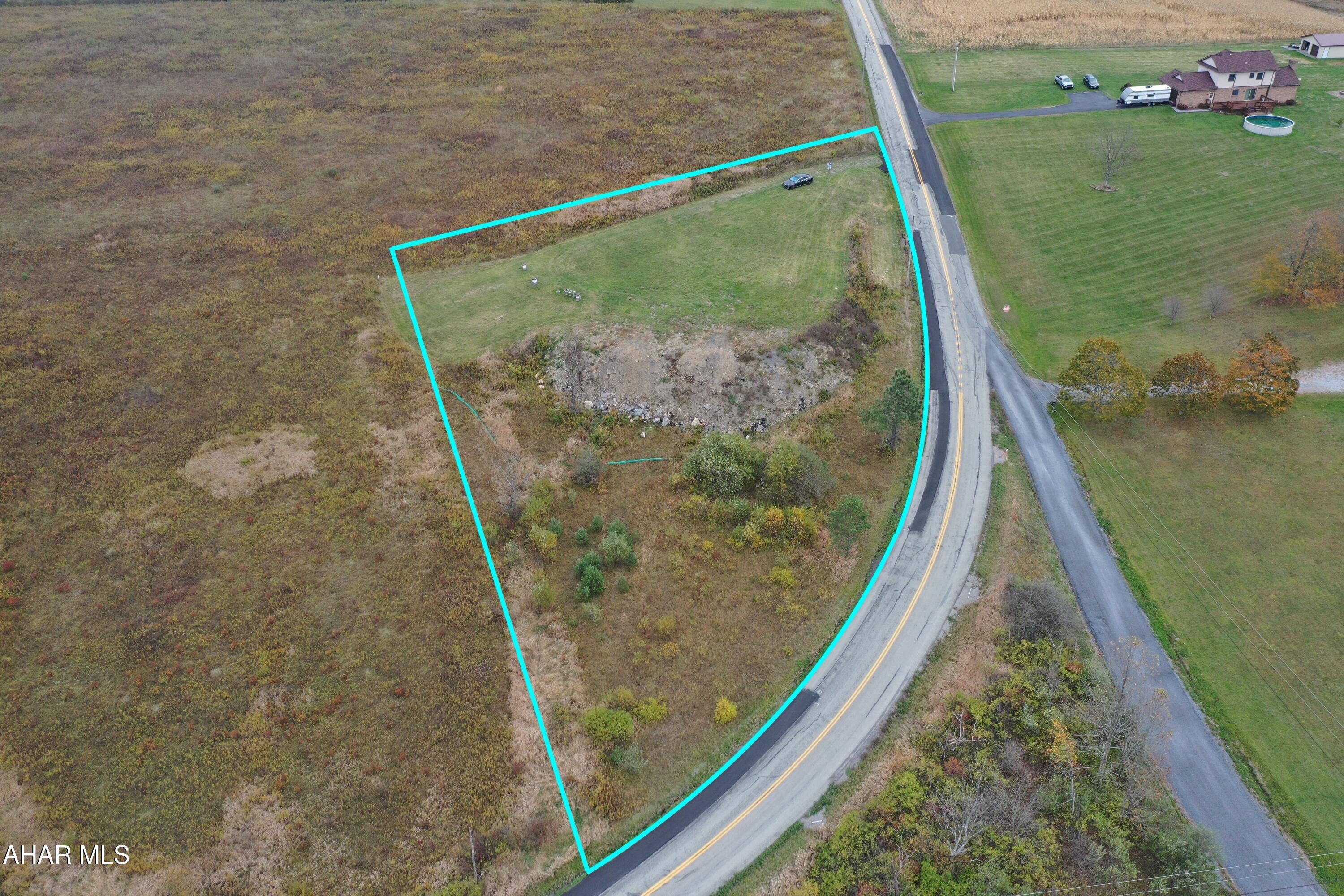 Prime approx 1.5-Acre Corner Lot in Loretto PA

Don't miss this excellent opportunity to own a level, approx 1.5-acre corner lot in the peaceful community of Loretto. Offering plenty of potential, this versatile parcel is ideal for building your dream home, a storage garage, or an investment project.

Electric service is available at the property line. A septic system and well would be required, and a perc test will need to be conducted to determine suitability for on-site septic installation.
Whether you're looking to build now or invest for the future, this property is full of possibilities.

A Highway Occupancy Permit has already been obtained for the driveway.

Property lines depicted in blue are approx and would need to be confirmed with a survey.

Coordinates are 40.554112,-78.644369 - just copy and paste into Google Maps.