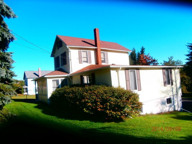 Clean and well maintained two story on double lot. Mac drive and two car int garage. Enclosed front porch. Small log outbuilding.