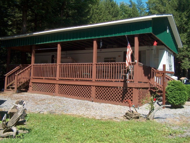 Fabulous, furnished 2001 Keystone Sprinte camper w/full covered deck & shed Large rooms Second lot for camping or parking.