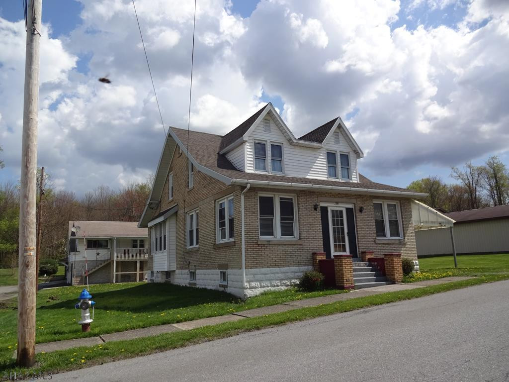 A must see! Beautiful oak wood throughout this house. Dining room w/ built in cabinets & windows seat! Master bedroom 14x22.5, spacious rooms, heated enclosed front porch. Great location. New roof. Beautiful hardwood floors.