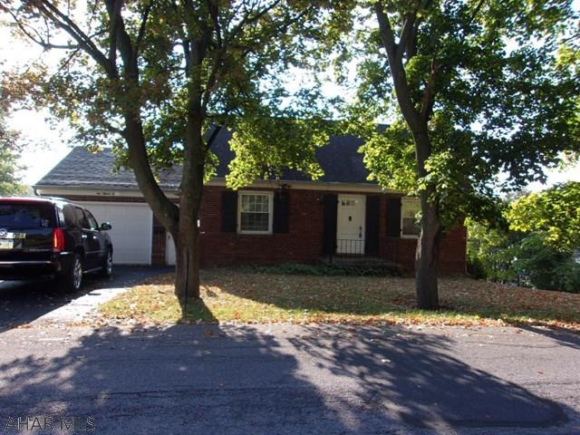 Privacy in the city!  3 bedroom, 2 1/2 bath home on a quiet, low traffic street with a nice size lot.  1st floor features a living room, dining area, kitchen, bedroom, and full bath.  2nd floor has 2 bedrooms which offer great natural light and an abundant amount of closet space, and a 2nd full size bath.  Basement if finished with a family room containing a mountain stone fireplace and bar area, a laundry room, 1/2 bath, TWO bonus rooms, and lots of built-in storage!  There is access from the basement to a screened in sunroom which leads to the terraced backyard.  Home also features a 1 car attached garage, modern vinyl thermo-paned windows, and newer furnace.  Don't miss out on this unique home!