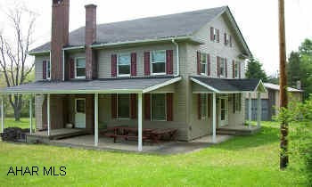 2 1/2 story 10 room hunting lodge from mid 1800's used as way station for Philadelphia-Erie Turnpike stage coach line. Stone fireplace, lg. covered patio, lg. 36x60  Morton Barn on 120 acres near State Game Lands.                                           2 1/2 story 2584 sq. ft. hunting lodge from the mid 1800's used as way station for Philadelphia-Erie Turnpike stage coach line.  6 bedrooms, stone fireplace, family room, den &  lg. covered patio.  All on 120 wooded acres with a  lg. 36  X 60  2160 sq. ft. heated Morton Barn with 8" concrete floor, stepped for 20x36 bay with 12x14 overhead door on a paved state highway.   The property is secluded with beautiful views of woods & fields, cleared trails through property, near State Game Lands.  All timber & mineral rights included, no zoning for many possiblities.  32 miles from State College, 25 miles from Tyrone, 6 miles from Clearfield.