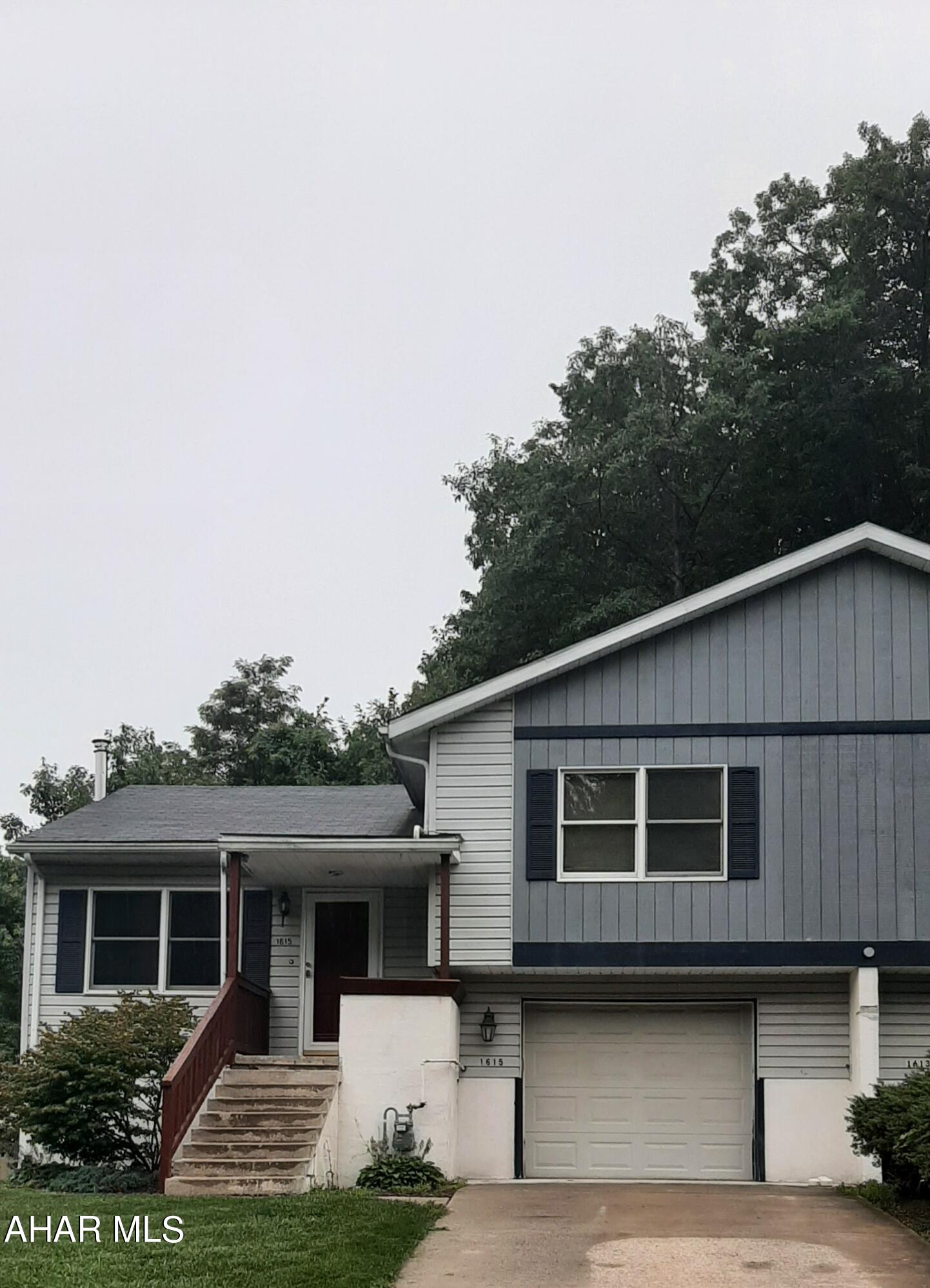 Half of Duplex in Logan Twp.... Main level has large eat in kitchen w/ garden window and newer appliances, den/ formal dining room leading to back deck, living room with laminate flooring. 2nd level has 2 bedrooms with large closets a full bath with a sky light. Lower level has family room, bonus room and a bedroom all with carpeting plus a flu for a wood burner or pellet stove. 1 car garage , utility room with 1/2 bath  Some other feature this home has to offer  are central air and electric baseboard heat. Set up a showing today. Listed for $120,000