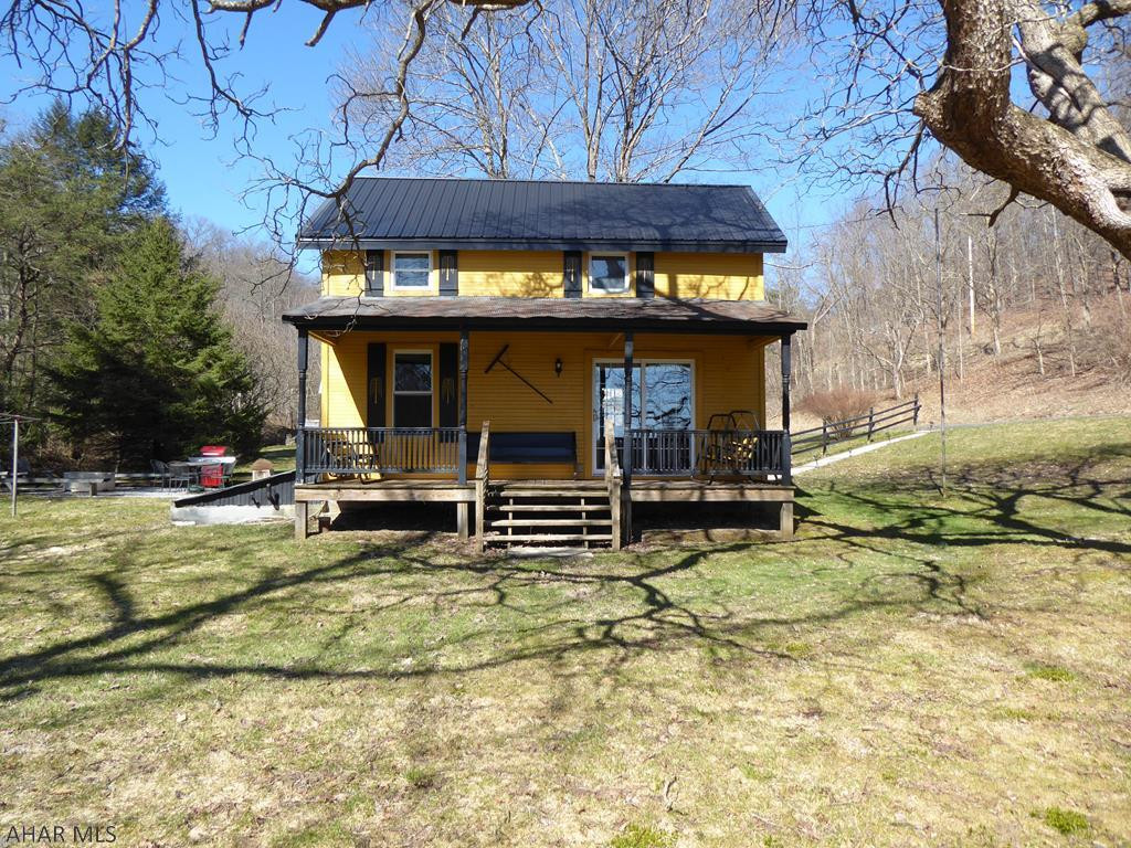 Come and sit on the front porch of this remodeled farm house! Enjoy the privacy of this 5 acre property which includes a stream and woods.   The property has the historic charm with new updates. The electric, roof, porches, and interior have all been updated in the last several years.  Only minutes from Historic Downtown Bedford, Omni Bedford Springs,and Shawnee State Park.