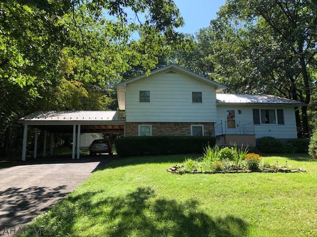 Very Private Setting is a 3 Bedroom 2 Bath Split Level on wooded 1.38 acres.  New Well Pump in 2018, New metal Roof and Gutters in 2019, and New Furnace in 2020.  Large 2 car covered carport with new metal roof and screened in Back Porch for entertaining and a storage shed in the back.  If you're looking for privacy there's only one house within view!  Call me for a showing!!  Doug
