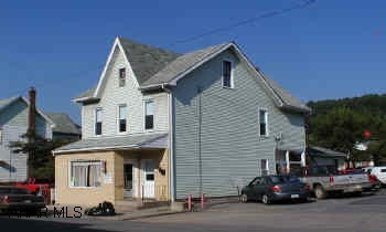 Most of the barber shop equipment goes with the property. First floor barber shop is presently rented.  First floor 2 bedroom apartment.  2nd floor 2 bedroom apartment.