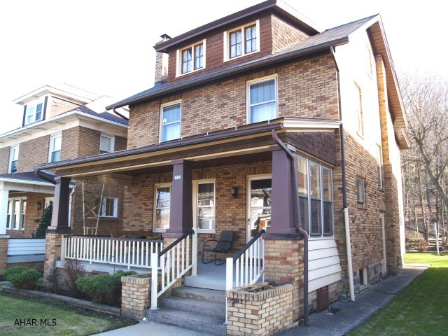 Classic 2.5 story, 3 bedroom brick beauty. All natural woodwork throughout this home. 2 enclosed porches, plus large, covered front porch in the borough of Tyrone. Wood burning fireplace, landscaped back yard, character galore! Call today for your showing.