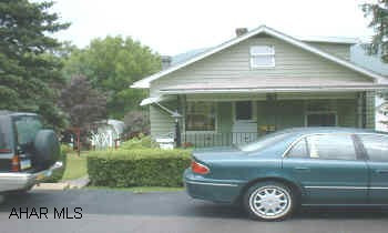 NEAT CAPE COD ON MANICURED LOT.  DETACHED GARAGE WITH WORK AREA, MODERN KITCHEN AND BATH, GAS HA HEAT, WALK-OUT BASEMENT, WOOD BURNER IN BASEMENT, 1/2 BATH IN BASEMENT.