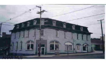 Building previously used as a Bank w/apartments upstairs. (currently vacant) Historic District. Feasbility study available. J-455 Building previously used as a Bank w/apartments upstairs. (currently vacant) Historic District. Feasbility study available. J-455