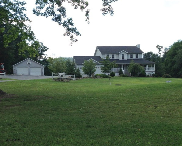 Impressive country estate within minutes of the town of Bedford on 4.237 acres. Gorgeous grounds surround the home where new maintenance free vinyl decking add fabulous outdoor living space both in the front and back. The new sunroom is sure to impress. (Over $60,000 in new renovations in the last two years.) Oversized eat in kitchen, dining and living rooms are surrounded by large windows and allow nature to be part of the indoor space. Upstairs, an oversized master suite complete with walk in closet, laundry room and bathroom add to the overall appeal of this one of a kind home. Two additional bedrooms share another full bathroom on the second floor. Two garages are attached to the house and another detached garage ensure there is plenty of room to store additional vehicles, etc.
