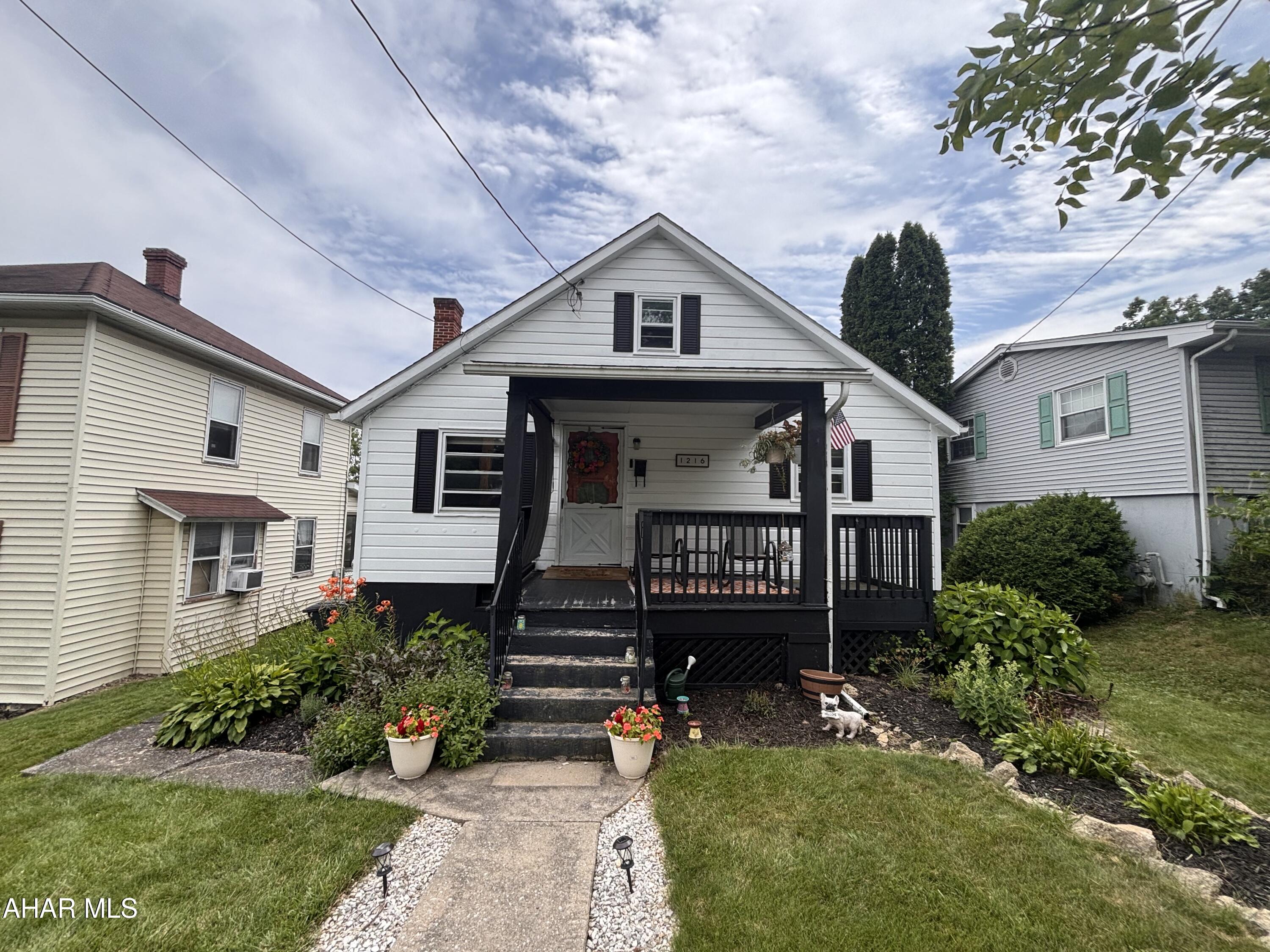 Come check out this home which features 2 bedrooms and 1 bath on the main floor, and a finished 2nd floor completed with heat and electricity which could make a 3rd bedroom. The basement also includes a 3/4 bathroom, a water heater installed in October 2024, a newer furnace, and walkout access to a spacious and private entertainment area and a relaxing, covered patio. Also, enjoy private relaxation on the front porch while still being close to the Hollidaysburg schools, the YMCA and more!