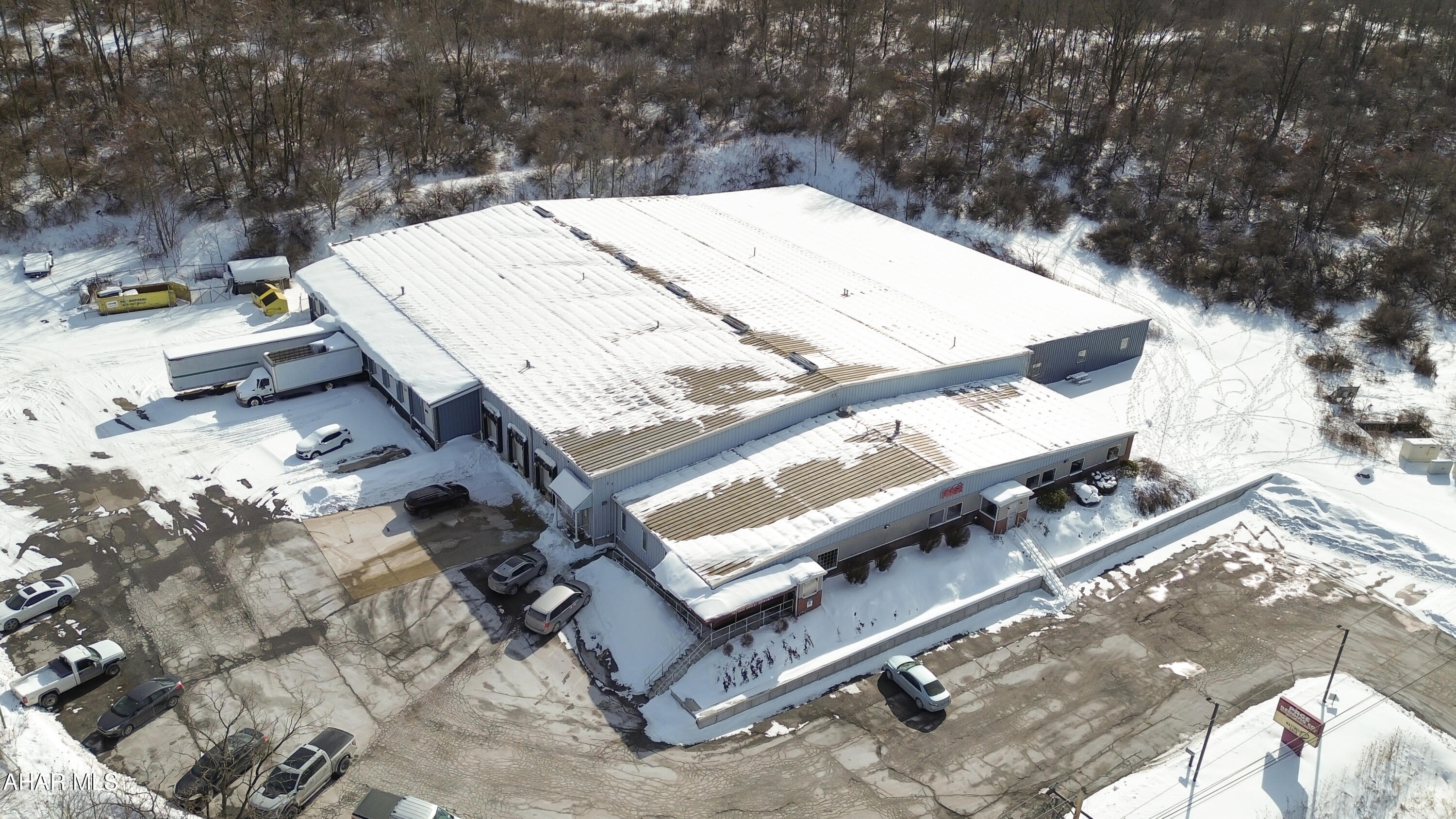 Prime Light Industrial (L-1) property with frontage along Eisenhower Boulevard, offering approximately 42,220 SF of functional industrial space on ~ 4.3 acres. The facility includes 25,200 SF of original manufacturing space, a 10,560 SF warehouse addition, 5,200 SF of finished office/showroom space, and a 1,260 SF covered loading dock. The front office area features reception, conference room, private offices, employee lunchroom, and multiple restrooms with gas forced-air heat and central air. The manufacturing and warehouse sections provide open work bays with 14' ceilings (12' in the addition), concrete floors, and 12 overhead doors for efficient loading and workflow. Infrastructure includes a 600-amp, 3-phase electrical service, wet sprinkler system, compressed air system with three air compressors, and multiple gas-fired heaters. The addition also features electric radiant floor heat. The steel-framed structure offers brick and decorative finishes at the showroom facade, paved parking, partial fencing, and full public utilities (water, sewer, electric, natural gas). A well-equipped, high-capacity industrial asset ideal for manufacturing, warehousing, or distribution operations. Call today for more information!