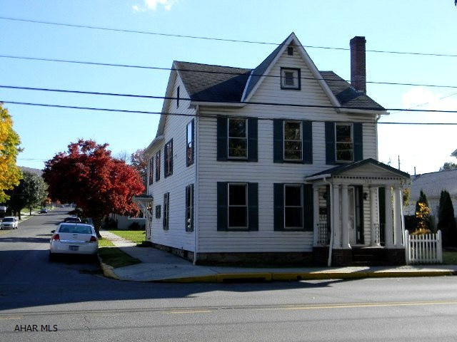 2-story vinyl 3BR/ 2BA colonial on corner lot w/ fenced yard. Conveniently located near schools and walking distance to downtown shopping. Ready for use as single family or duplex. Nice condition. Offered AS-IS. Definately priced right to sell.