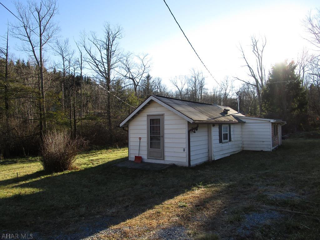 REDUCED!!  CASH ONLY - no mortgage---------Enjoy your privacy and only be minutes from shopping!   Approximately 1/4 acre of ground.  Adjacent to State Game Lands!  A hunter's dream.    Tankless hot water tank for INSTANT hot water:)  SELLING AS IS