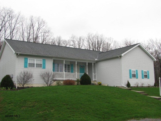 Brick/ vinyl Tyrone ranch home with attached 2 car garage, LR., Dr., EIK., 3 bedrooms, 3 baths, 24x29 family room w/gas fireplace, bonus kitchen in basement, 1st floor laundry hardwood floors, french doors, covered porch & patio, 17x36 detached garage great for RV parking-plus workshop area