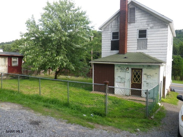 Nice 2 story house on fenced lot. Eat-in kitchen, 1 1/2 baths. Rec room, oil HW heat. Shed