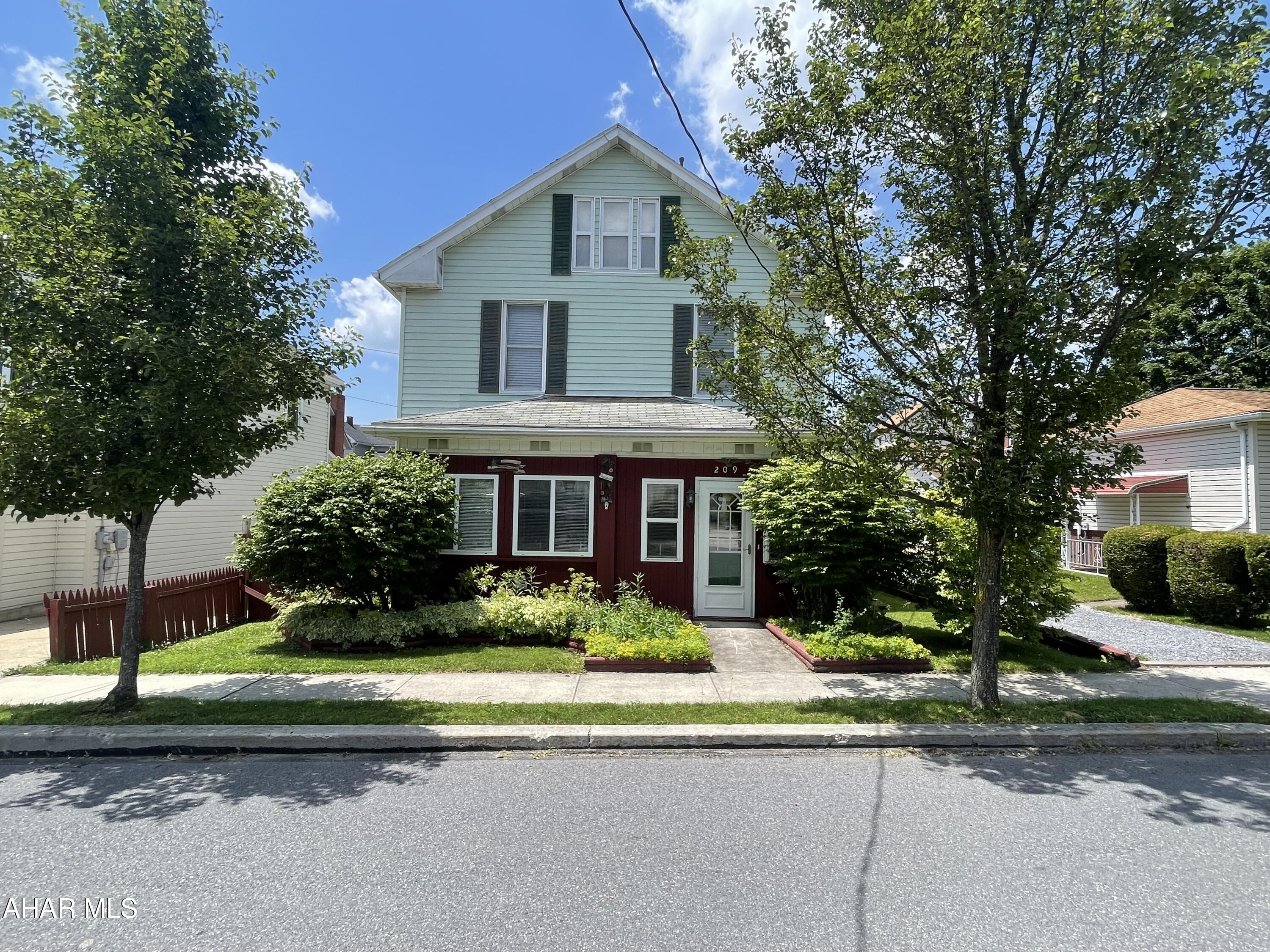 This 3 bedroom 1.5 bath spacious home in the heart of Ebensburg borough is walking distance to all businesses that the area has to offer.  First floor offers many additional seating areas for you to enjoy your morning coffee/tea, the kitchen is spacious and allows room for a table if you like, dining room is currently being used as a family room and features hardwood floors, there is a living room and large foyer for coats and shoes.  The second floor has 3 nicely sized bedrooms, a full bath that leads to a finished attic which has mostly recently been used for storage.  The shared driveway leads to a garage/outbuilding the perfect place for hobbies or toys.  Call today for more information. Buyer to verify all measurements.