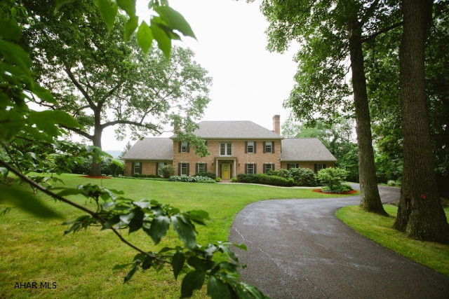 Stunning, custom, brick Home on one of the most sought after streets in Blair County...Adjacent to Blairmont Golf Course, restaurant and swimming pool. Located at the end of a quiet cul-de-sac, this home combines elegance and comfort. Picture yourself enjoying  evenings in the 2 story great room...featuring a stone woodburning fireplace...floor to ceiling windows allow you to take advantage of the gorgeous views.  New kitchen boasts bird's eye maple and natural cherry cabinets, state of the art Miele appliances and a huge center island....again a great view from the large windows.  Entertain on the patio and enjoy the in-ground pool.  First floor owner's suite with a huge bath...double sink areas, jacuzzi tub and his and hers walk-in closets. A 1 Year Home Protection Plan will be provided.