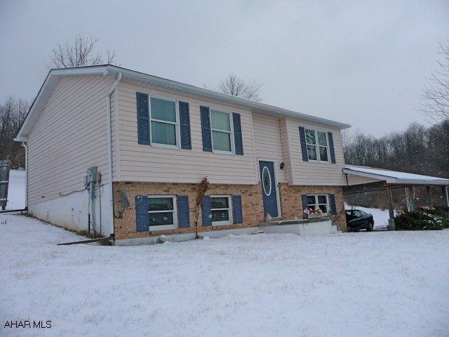 Very nicely maintained 1994 Split Entryhome 2BR/1BA.  Private setting with 11.6 Acres offering great views.  Open floor plan with full walkout basement 2 car attached carport 200 amp electrical well, sand mound septic.