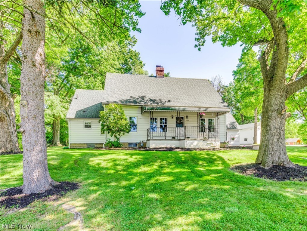 You want space.. Over 1.5 acres with an approximate 1400 square foot barn that can be used as a workshop, barn parties, automobile storage, and has electric, 120v...Great for any hobby! Also, you have an additional shed with a concrete floor..now for the charm of the past...built in 1927. Gorgeous natural wood work. The living room and dining room open up to each other. The living room has a wood burning fireplace. The updated kitchen is gorgeous with granite countertops, tile floors and cherry cabinets. All the bedrooms have hardwood floors. Enclosed sun room off the back with a walk-up attic that could be finished into another bedroom or studio. The two-car attached garage also has a walk-up attic for more storage. The roof, furnace & AC approx. 2014, new windows 2017..