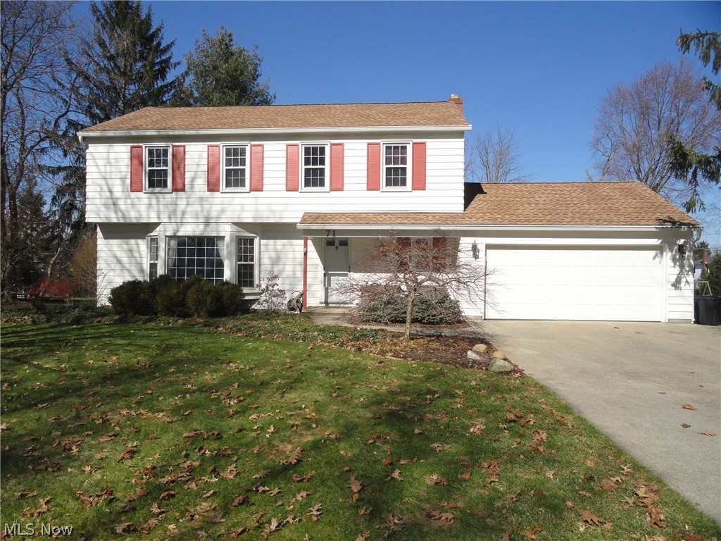 Charming Colonial in desirable Hudson neighborhood close to historical downtown Hudson and community parks. Lovingly maintained by the same family for many decades. Formal living room with huge bay window welcoming the sunlight. Beautiful hardwood floors throughout most of the first floor and all 4 bedrooms. Lovely kitchen with updated cabinets and appliances opens to the formal dining room or the cozy family room w/woodburning fireplace and continues to  the 15x30 great room addition with cathedral ceiling and generous sized window brightening the  living area throughout. Updates include roof, HVAC, windows, bathrooms & kitchen. Patio overlooks spacious flat and grassy yard with plenty of  room to run! Seller offering home warranty too. Call today for your private showing.