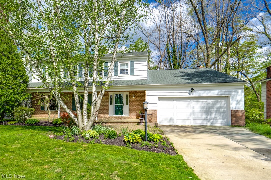 Location doesn't get any better than this! Nestled in a charming neighborhood with sidewalks throughout, this stunning home offers a front-row seat to nature, with Sand Run Metro Park being minutes away. Step onto the two-tiered deck and take in breathtaking views of the woods. Out front is a nicely sized paved driveway that leads to a two-car attached garage and a covered front porch. Inside, you'll fall in love with the character and warmth this home exudes. Beautiful hardwood floors flow throughout much of the home, complemented by built-ins in the living room. The updated kitchen impresses with granite countertops, wood cabinetry, tile flooring, and a dinette area that leads to the back deck, making entertaining a breeze. The family room features a cozy wood-burning fireplace and serene views of the wooded backyard. A formal dining room and a convenient half bath round out the main level. Upstairs, you'll find four spacious bedrooms, all with hardwood floors, served by a well-appointed full bathroom with double sinks and a tub/shower. The main suite includes its own private bath with a tile surround. The partially finished walk-out basement adds even more living space and currently features a large rec room and exterior access. Don't miss your chance to see this beautiful home; schedule your showing today!